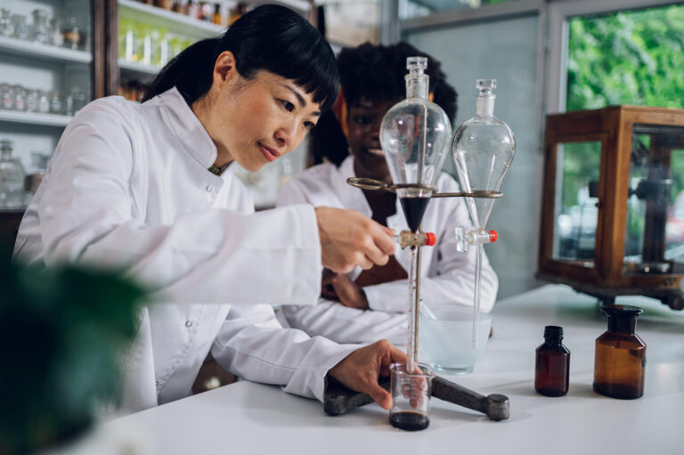 a-japanese-pharmacist-is-using-a-funnel-with-her-a-2025-04-02-07-53-25-utc